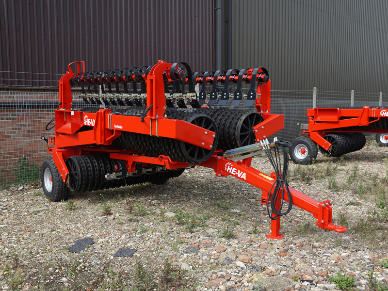 8.2m HE-VA Tip Rolls folded in transport position in yard, unhitched