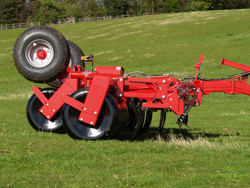 Hydraulic-folding HE-VA Grass Roller fitted with Spring Tines and a Shattaboard lifted out of work