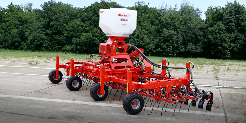 HE-VA Grass-Combi in yard, fitted with Stocks Turbo Jet 8 Seeder