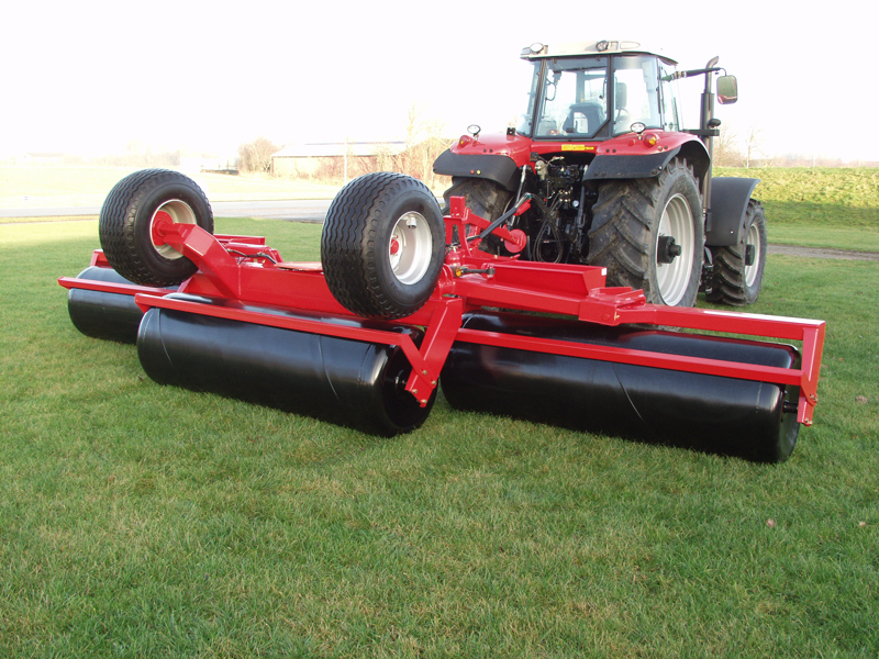 Unfolded HE-VA Grass Roller behind a Massey Ferguson tractor