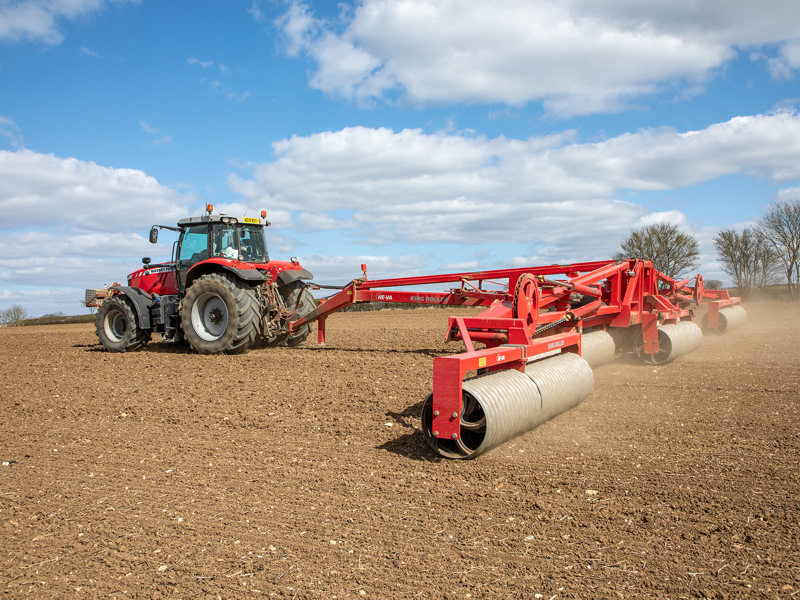 Rear view of 16.3m HE-VA King Roller behind a Massey Ferguson tractor