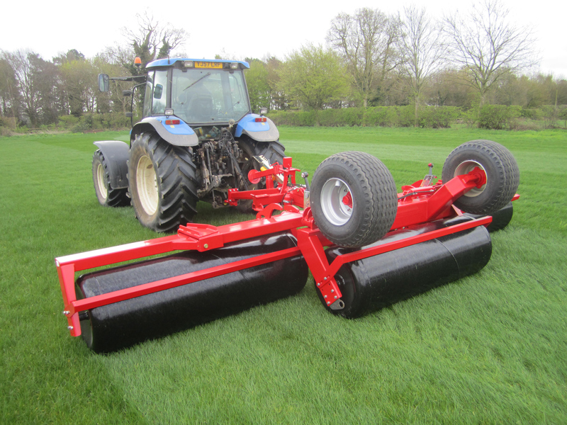 6.3m HE-VA hydraulic-folding Grass Rolls behind a New Holland tractor
